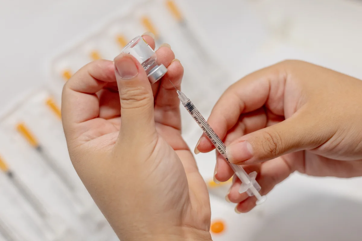 Close-up of an injection being prepared — iCRYO Westminster, CO wellness guide