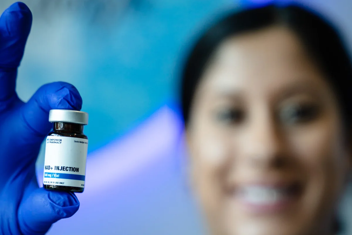 Clinician holding a nutrient injection vial — iCRYO Westminster, CO wellness guide