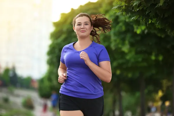Woman running outdoors to support fitness and muscle health — iCRYO Westminster, CO wellness guide
