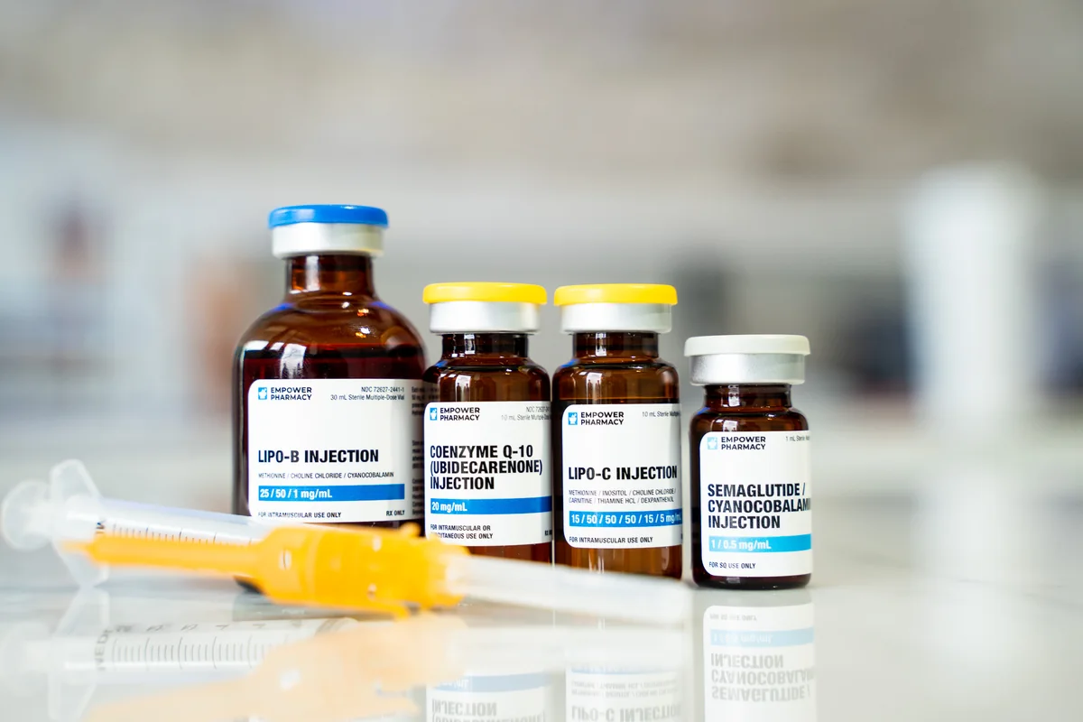 Vitamin vials and a syringe arranged on a counter — iCRYO Westminster, CO wellness guide