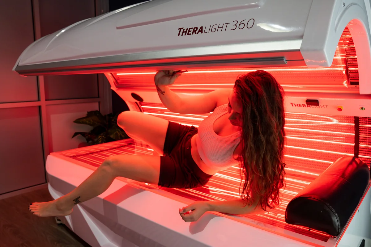 Client entering a red light therapy bed — iCRYO Westminster, CO wellness guide