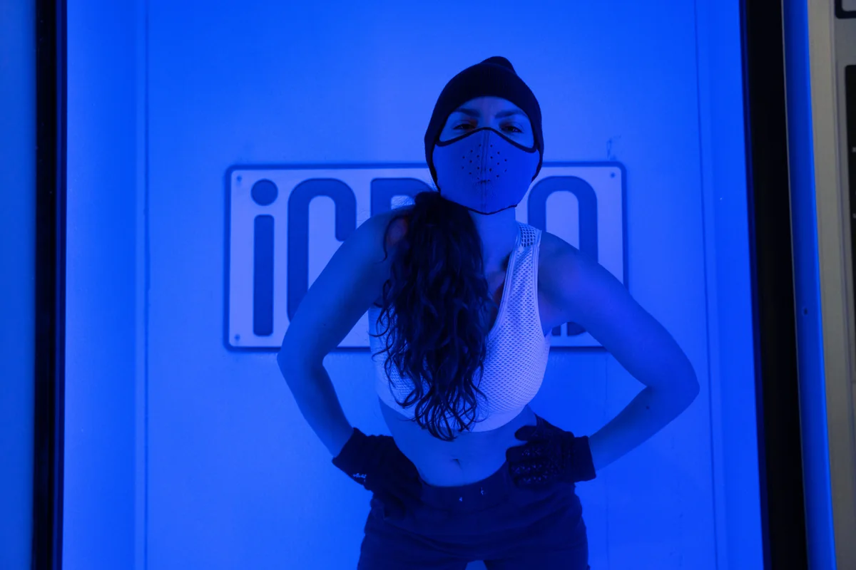 Client standing inside a whole-body cryotherapy chamber — iCRYO Westminster, CO wellness guide