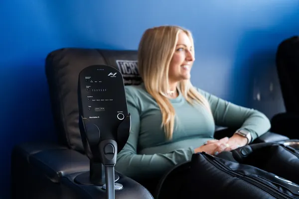 Client relaxing during pneumatic compression therapy — iCRYO Westminster, CO wellness guide