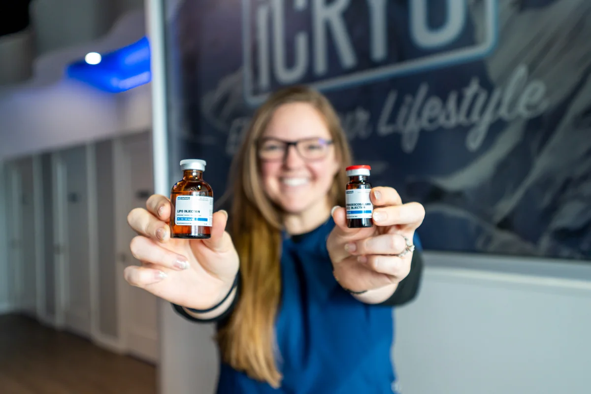 Vitamin injection vials held by a clinician — iCRYO Westminster, CO wellness guide