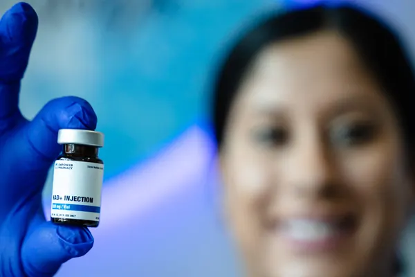 Clinician holding a nutrient injection vial — iCRYO Westminster, CO wellness guide