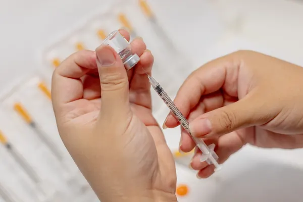 Close-up of an injection being prepared — iCRYO Westminster, CO wellness guide