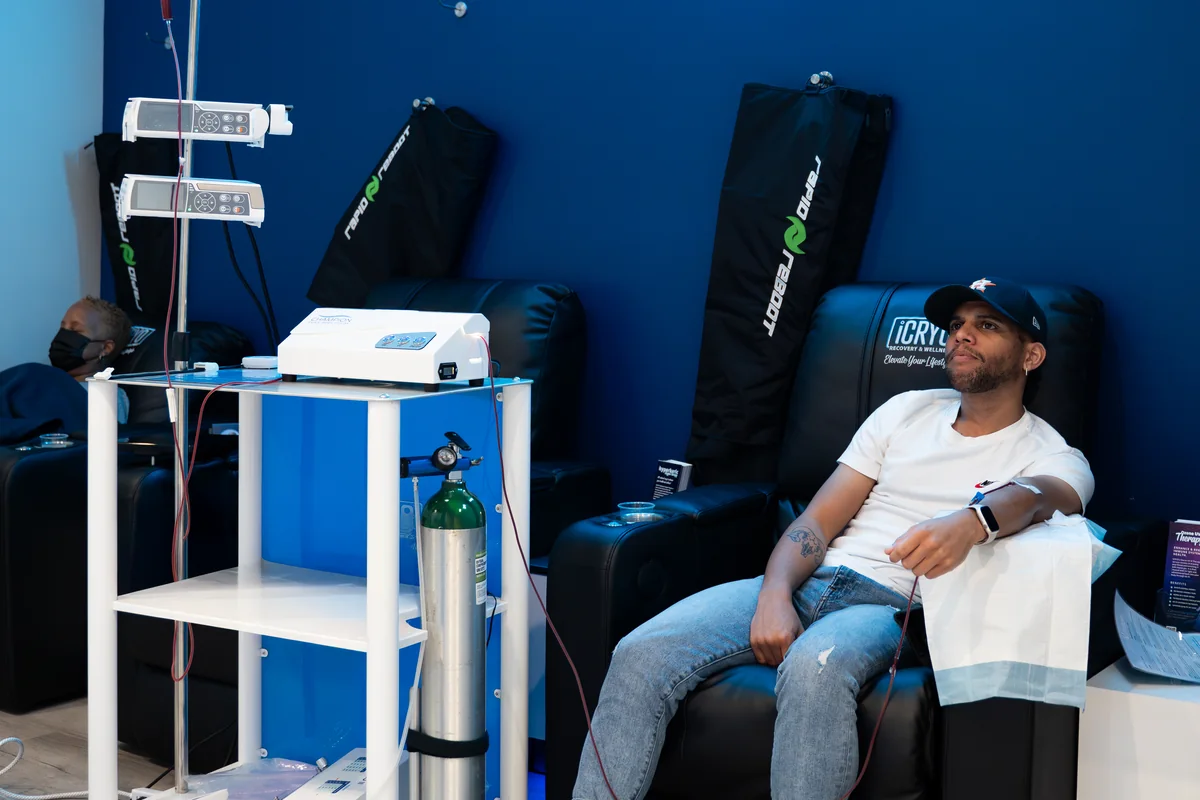 Client relaxing beside ozone IV equipment — iCRYO Westminster, CO wellness guide
