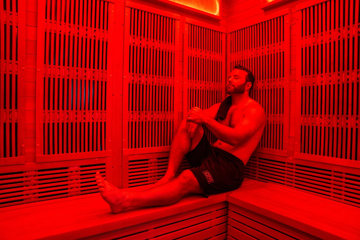Client seated inside an infrared sauna — iCRYO Westminster, CO wellness guide