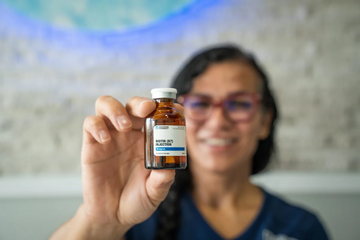 Clinician holding a vitamin injection vial — iCRYO Westminster, CO wellness guide