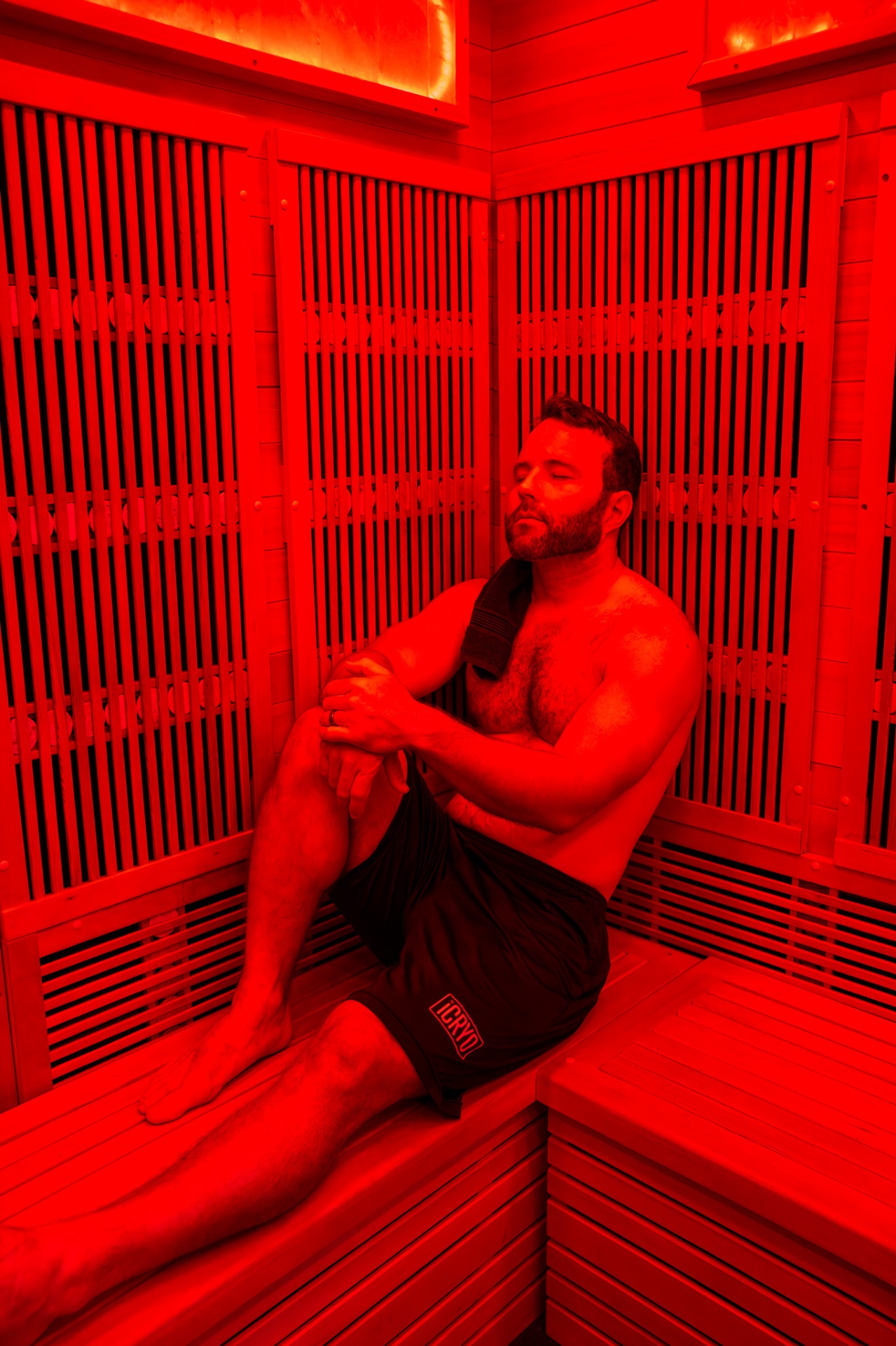 Guest relaxing inside a full-spectrum infrared sauna at iCRYO Westminster